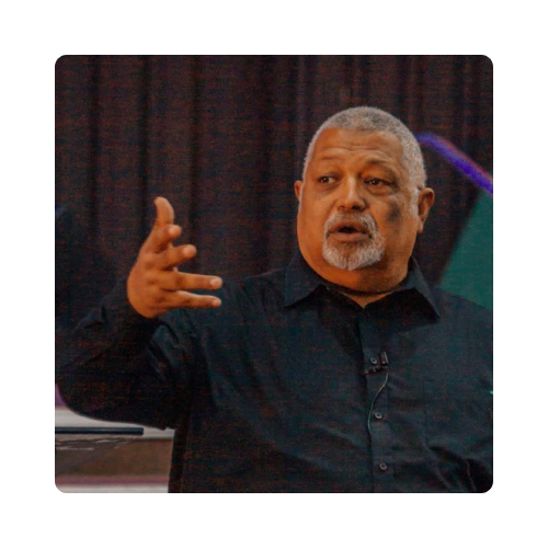 Apostle Jerome Liberty speaking and gesturing with his hand